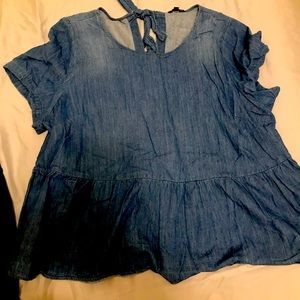 Denim peplum top with tie back detail